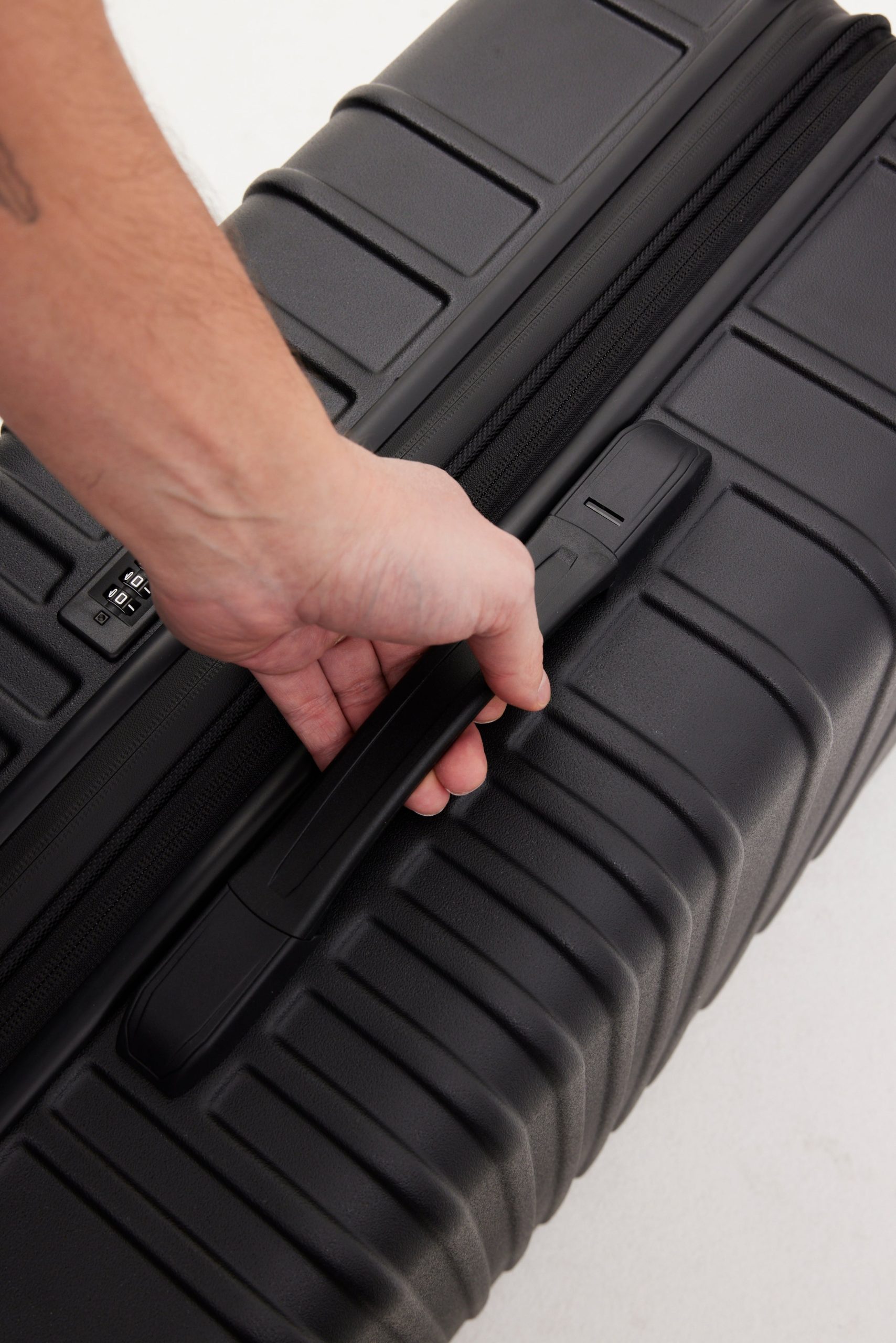 The Medium Check-In Roller in All Black - Image 10